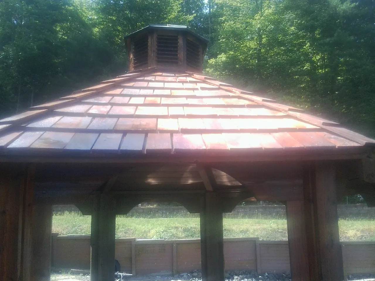New cedar shake roof and cupola on a lakeside gazebo in Spencerville
